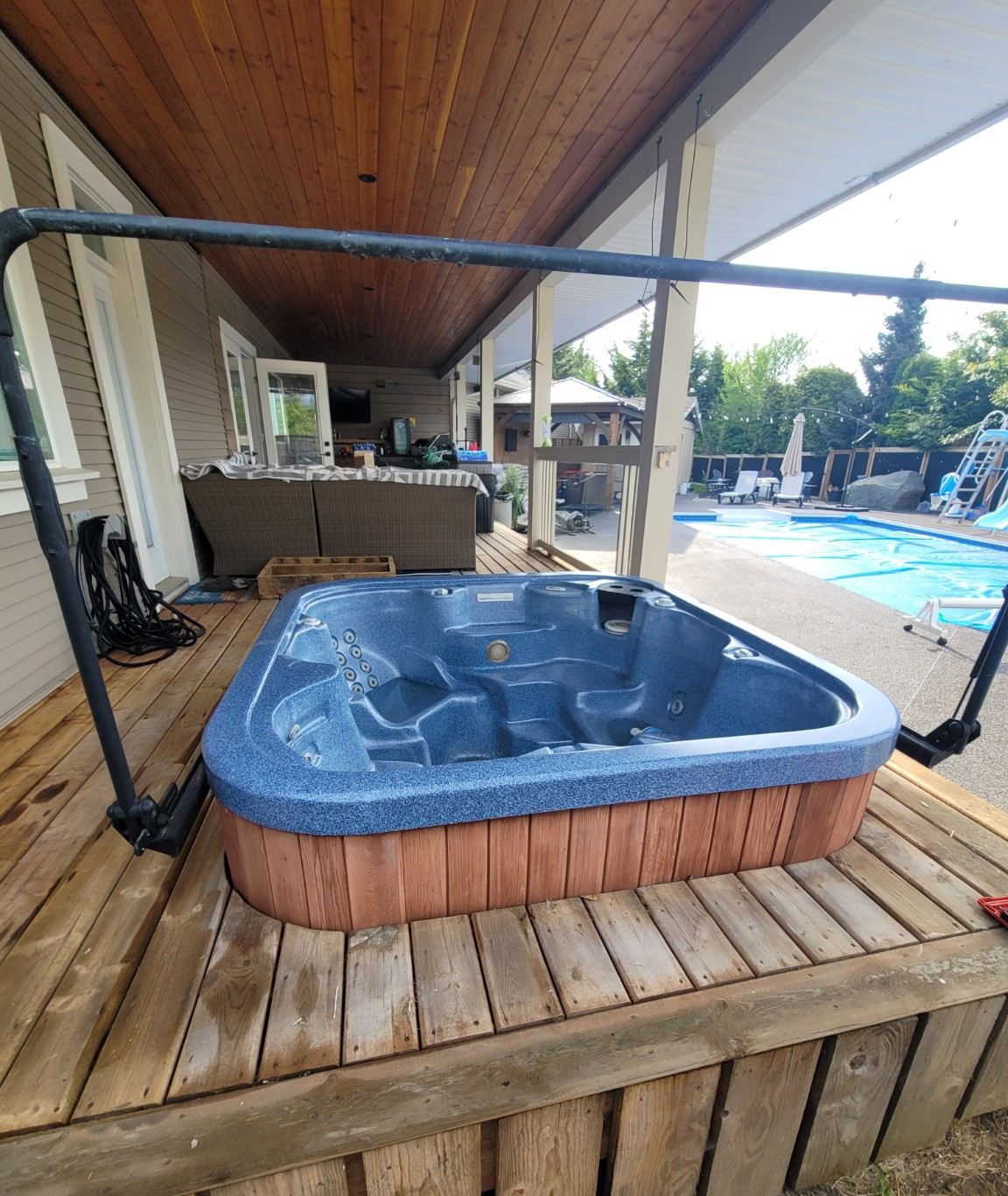 Hot tub on a covered cedar deck near Diver Lake before removal