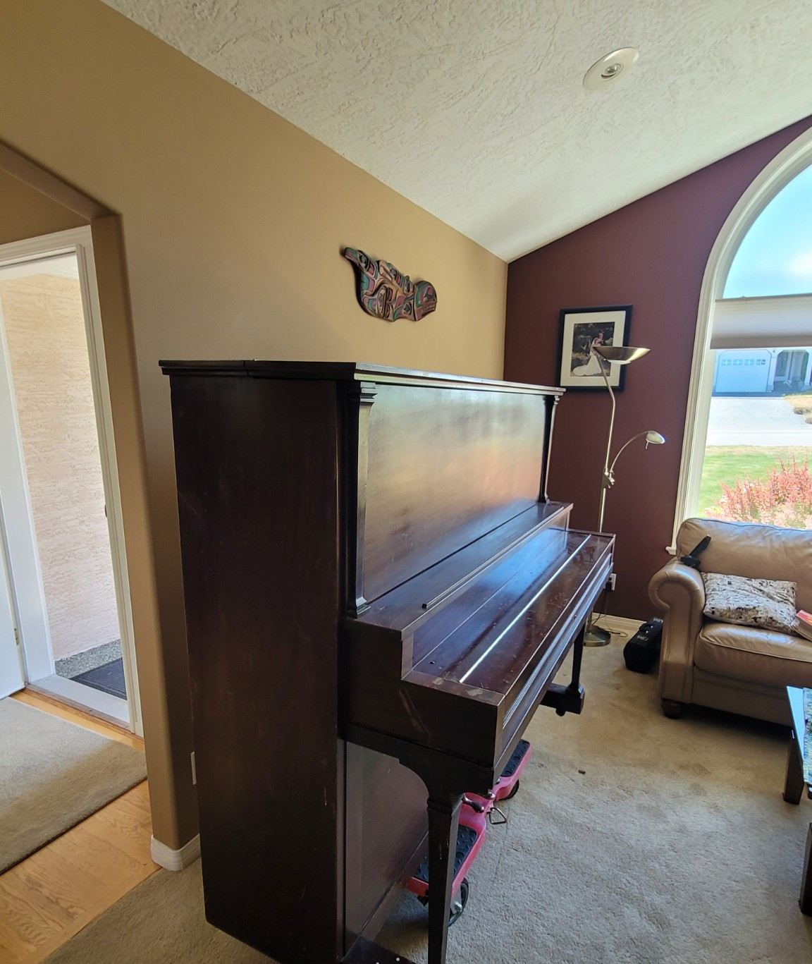 Upright piano in Dover Bay on a moving dolly ready for removal