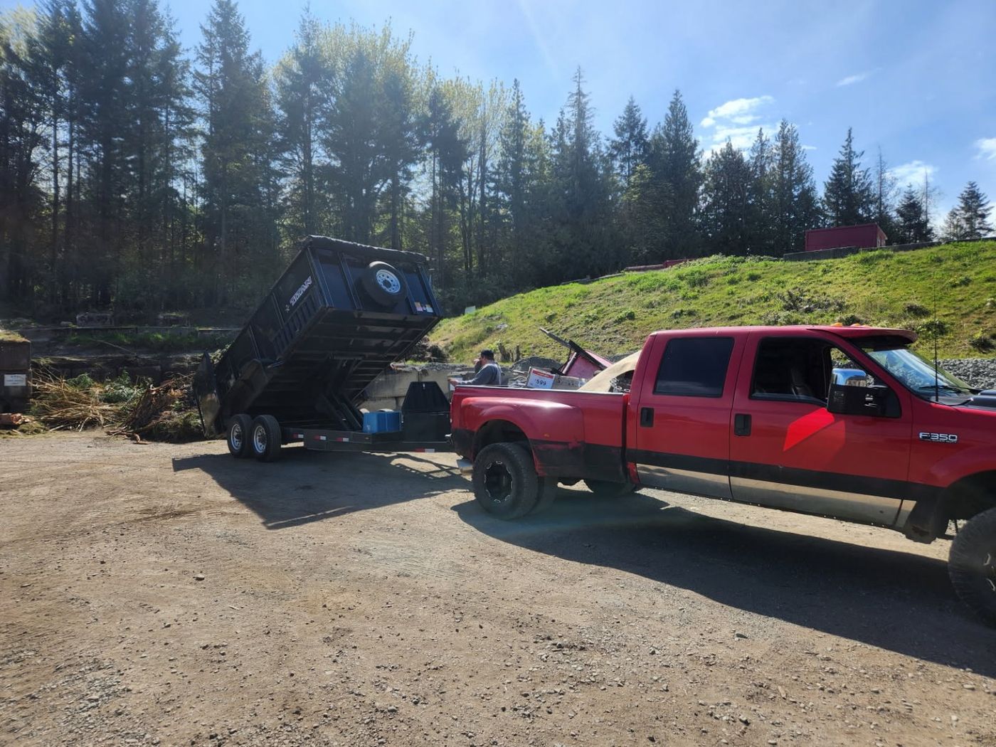 The Junk Matters truck and dump trailer tipping a load at the Nanaimo disposal site